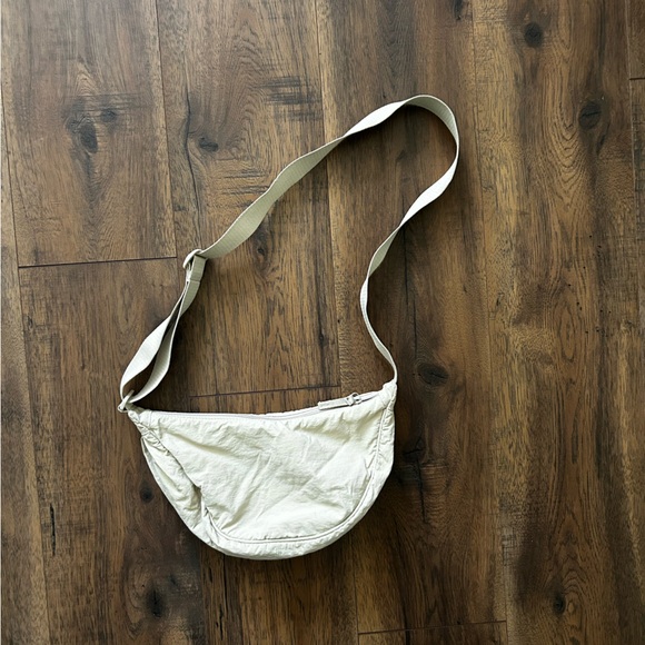 Uniqlo Handbags - Uniqlo Cream Crescent Crossbody Bag